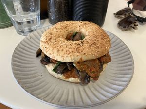 Harissa, spinach & mushroom bagel  at Sunday Cantina in Raumati