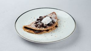Cacao ceremony pancakes
(cacao cream with dates, brownie, coconut whipped cream) at Surya Soul Temple Cafe in Pula