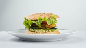 Falafel burger
(Hummus, cucumber, tomatoes, falafel, pickles, salad, tahini, mustard) at Surya Soul Temple Cafe in Pula