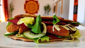 Homemade organic spelt chapati filled with Humus, lettuce, cucumber, tomatoes, red beet, Falafel and Tahini at Surya Soul Temple Cafe in Pula