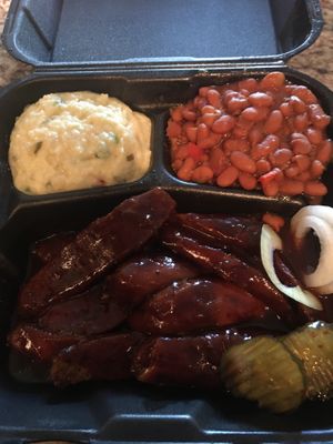 BBQ links with potato salad and brown beans at Houston Sauce Pit in Houston