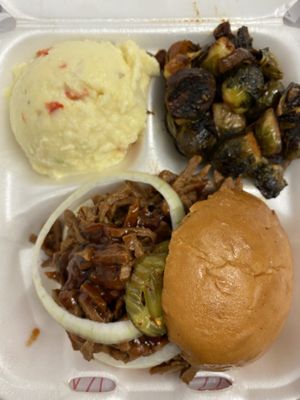 Veef sandwich with potato salad and brussel sprouts  at Houston Sauce Pit in Houston
