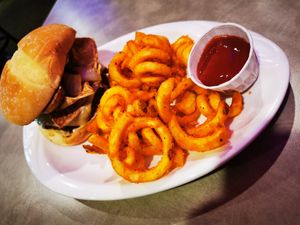 Bacun burger with blue chee and curly fries at The Bayside Cafe in Everett