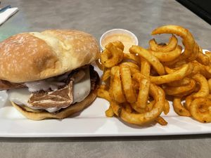 Bacun burger with curly fries  at The Bayside Cafe in Everett