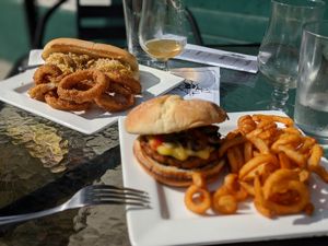 Scorpion Burger with curly fries; German Brat with onion rings at The Bayside Cafe in Everett