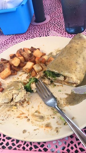 The best breakfast burrito I’ve ever had! Took plenty of self control to pause and take this picture before inhaling the rest. at Good Truckin' Diner in Lansing