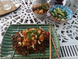 Popcorn tofu wok noodles with curry spring rolls and garlic pak choi at B8 in Dorchester