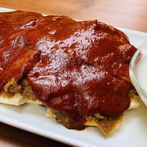 Vegan Iskender (a Turkish speciality of vegan doner slices on chopped flat bread with tomato sauce and vegan yogurt on the side) at Veganzza in Istanbul