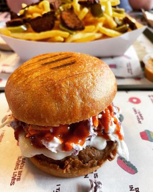Spicy buffalo chik’n burger  at Nosh Cravings in Doha