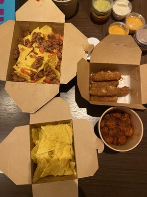 Nachos, cheese sticks, chips, wings  at Nosh Cravings in Doha