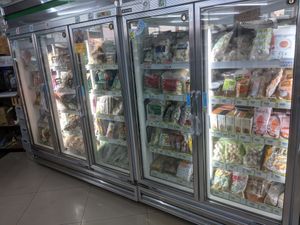 Large selection of frozen foods like dumplings at XīnXiān Hǎo Shì Jí 新鮮好市集 in Hemei