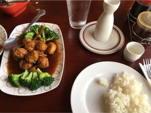 Veggie orange chicken with a side of rice and hot sake. Delish! at Garden Fresh in Palo Alto