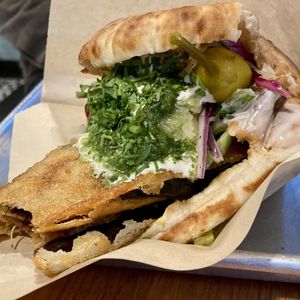 Sabich Pita, Spicy w/ a bite out of the eggplant (alternate angle)  at Tamam - Upper East Side in New York City