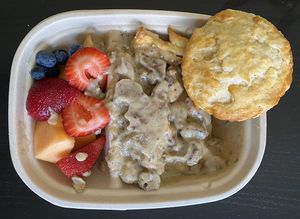 Biscuits & gravy, side of fresh fruit (always so perfect)  at Mud Pie Stand in Sacramento
