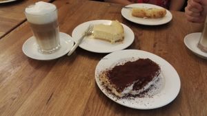 Caffe Latte, cheese cake and tiramisu (in front) at vego Foodworld in Berlin