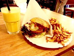Burger, chips and mango lassi  at vego Foodworld in Berlin