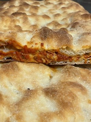 Pizza farcita con Beyond Meat al sugo at Aldo's Bakery in Turin