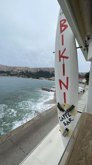 Directly at the Pier at Bikini Cafe in Baska