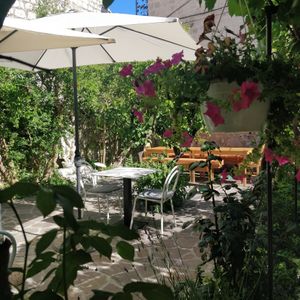 Reserve a table in our beautiful garden! at Nook in Stari Grad