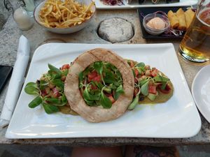 The big o salad, truffle fries and spring rolls at Nook in Stari Grad