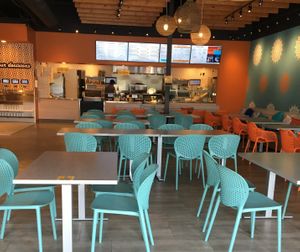 Dining area and ordering counter at Bombay Pizza Kitchen in Plymouth