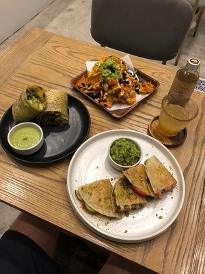 Pumpkin burrito (good), Sweet potato nacho plate (good!), lychee kombucha (good!) and Southwest quesadilla (very good!) at Plantiful - Plant-based Cafe in Bangkok