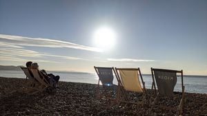 Kiosk deck chairs on beach at Kiosk in Lyme Regis
