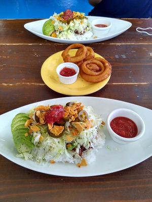 Avocado taco rice with jalapenos. 
Also onion rings  at Taco Rice Cafe Kijimuna in Onna