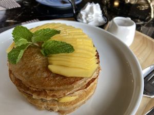 Pancakes with mango and coconut whipped cream at Goodsouls Kitchen in Bangkok