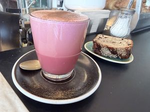 Pink dirty chai and vegan banana bread  at Hasard in Biel