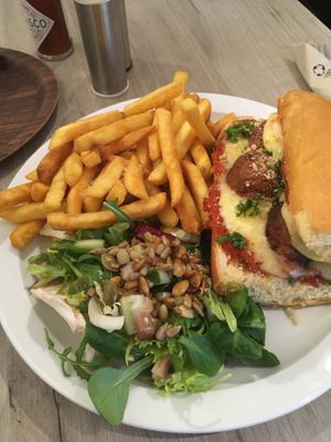 Meat sub (including vegan cheese) with fries and a side salad  at Lucifer Lives in Brussels