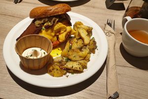 Egg and bacon bagle with rosemary potatoes at Lucifer Lives in Brussels