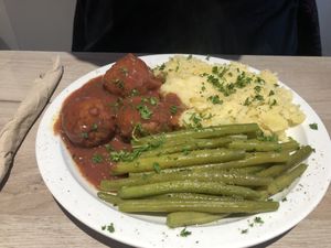 Meatballs with purée and beans  at Lucifer Lives in Brussels
