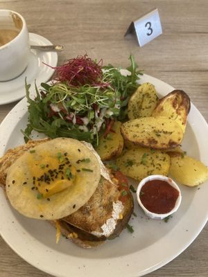 Croque monsieur (grilled cheese) with side salad and egg on top, 100% vegan  at Lucifer Lives in Brussels
