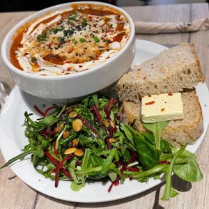 Tomato soup with plant-based meatballs, vegan parmesan served with a green salad, bread en plant-based butter € 10 (January 2026) at Lucifer Lives in Brussels