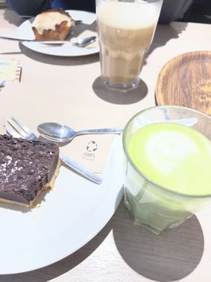 Carrot cake incl. cinnamon frosting and choco fudge shortbread with coffee and matcha lattee  at Lucifer Lives in Brussels