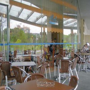 Exterior Seating Area with a Green View ... at Raj Restaurant - Biopolis in Central Singapore