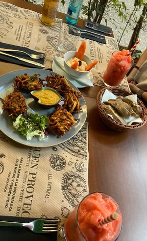 Coronita, limonada fresa, homemade hummus, pakora  at Tulsi in Barcelona