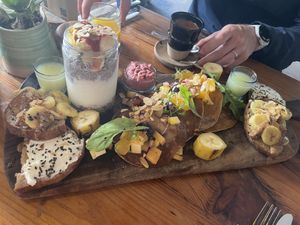 Brunch board (sweet) vegan amlou toast, fruit, hummus, and drinks   at Mandala in Essaouira
