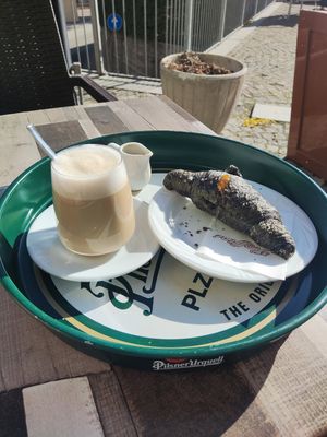 Oat latte and vegan croissant with apricot jam at Havana Café in Bardonecchia
