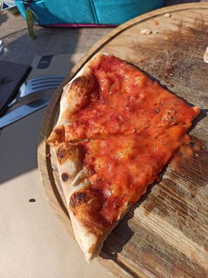 Pizza Margeritha. Habe das foto leider zu spät gemacht. at La Pentola in Porec