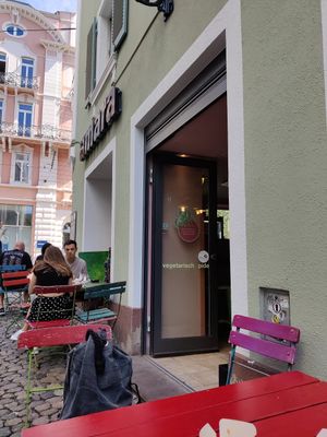 Outdoor seating. There is a one way system walk through. at Amara in Freiburg