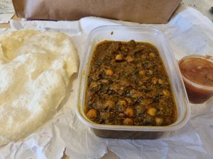 Channa saag and poppadoms with mango chutney at Kisimul Cafe in Isle Of Barra