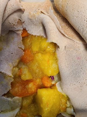 Potato carrot stew on injera at Lalibela in Sioux Falls