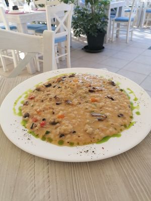 Mushrooms rizoro with porcini and trufa oil  at Jasmine Restaurant in Planos