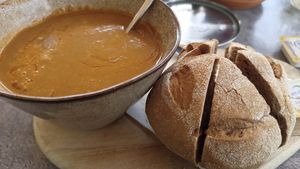 Zwarte linzen soep, met broodje en vegan boter at De 4 Jaargetijden  in Epen