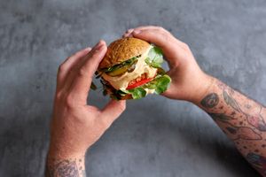 “Crab” cake burger with Caesar sauce and watercress at Holy Carrot in London