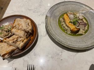 Bread and risotto  at Holy Carrot in London