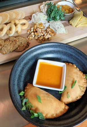 They make their own cashew cheese, OMG! Also, tempeh black bean empanada (gf) at The Cellar in Corning
