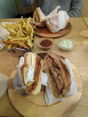 The cheese burger and the weon in the back at Les Tontons Veg in Paris